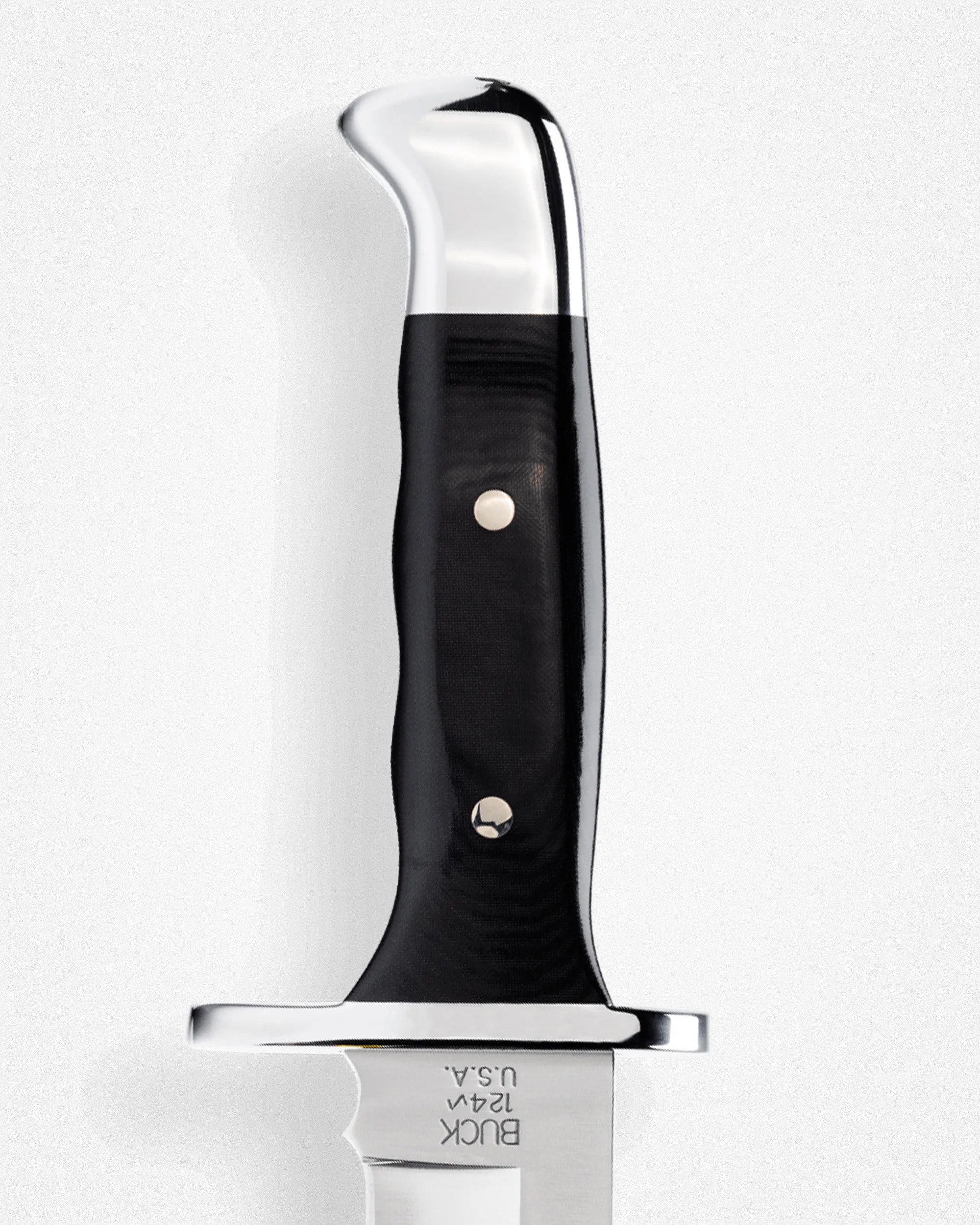 Handle of a Buck 124M knife with polished metal pommel and guard, and black textured grip with two rivets.