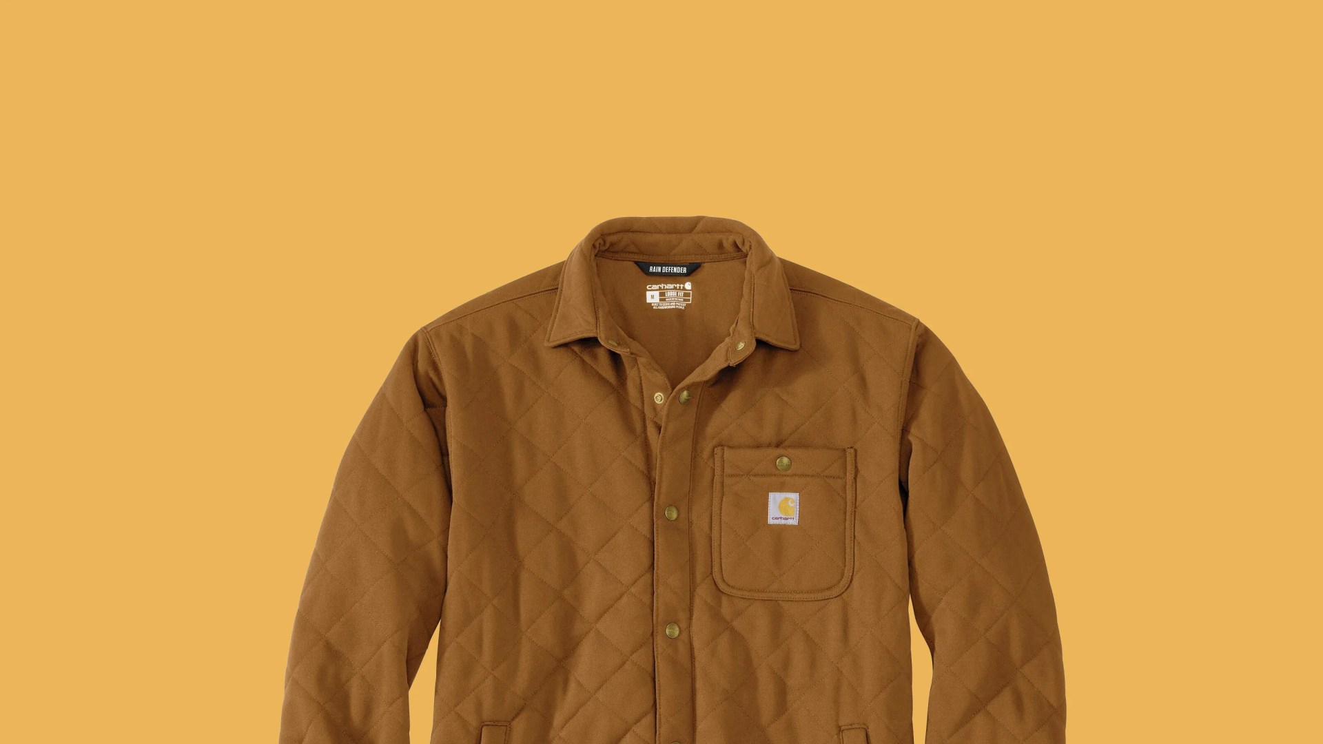 Brown quilted Carhartt jacket with snap buttons and chest pocket on a matching brown background.