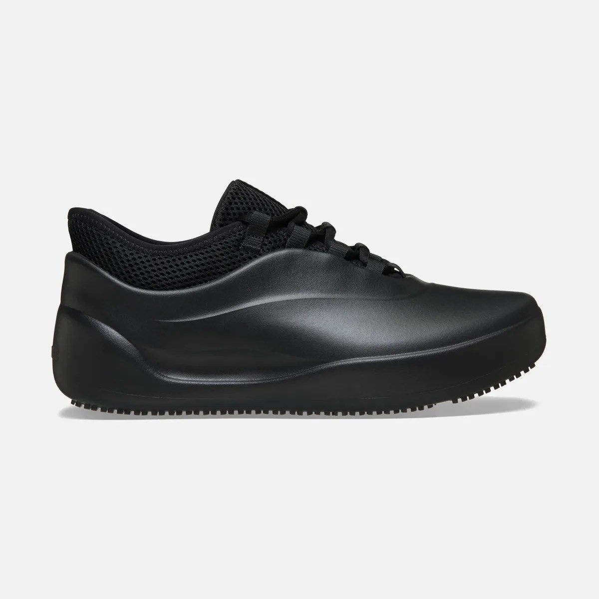 All-black sneaker with smooth synthetic upper and mesh collar, shown from the side on a white background.