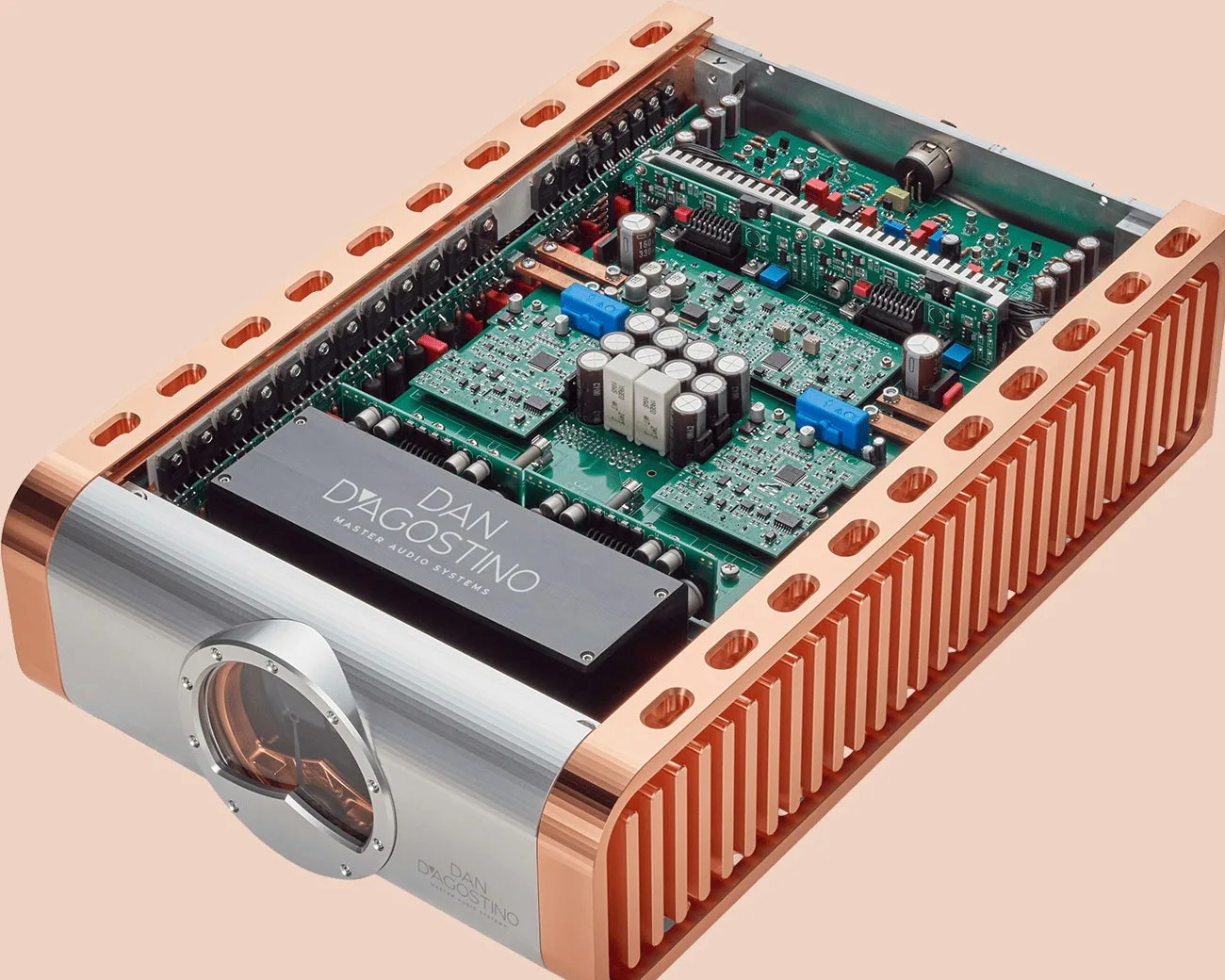 High-end Dan D'Agostino audio amplifier with exposed internal circuit boards and copper heat sink frame.
