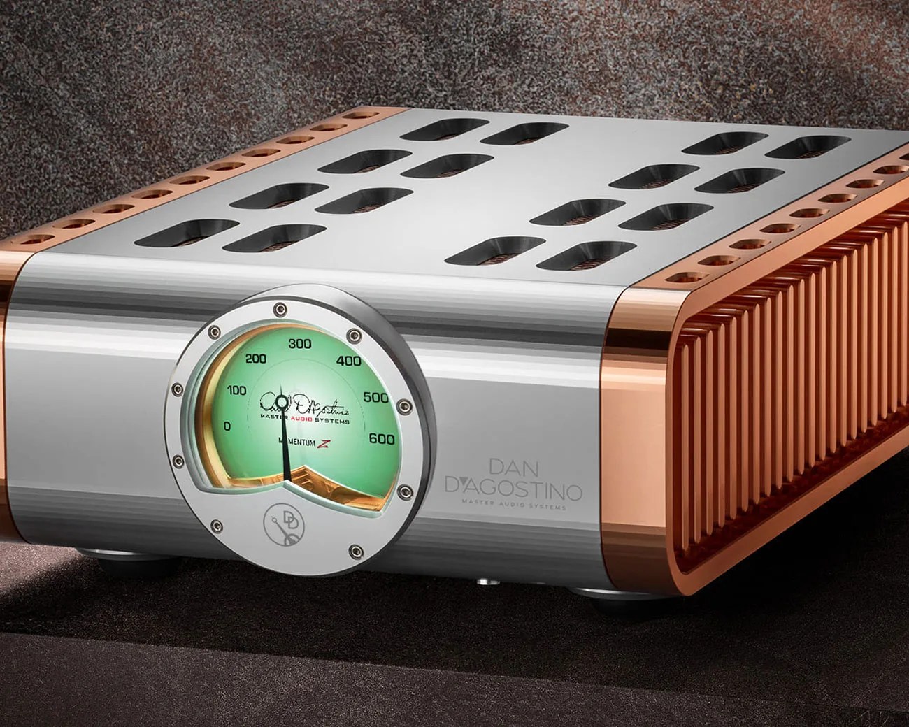 Silver and copper Dan D'Agostino Momentum Z audio amplifier with a green analog meter on the front panel.
