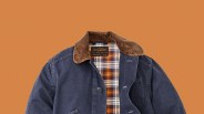 Navy blue jacket with brown corduroy collar and orange, navy, and white plaid lining.