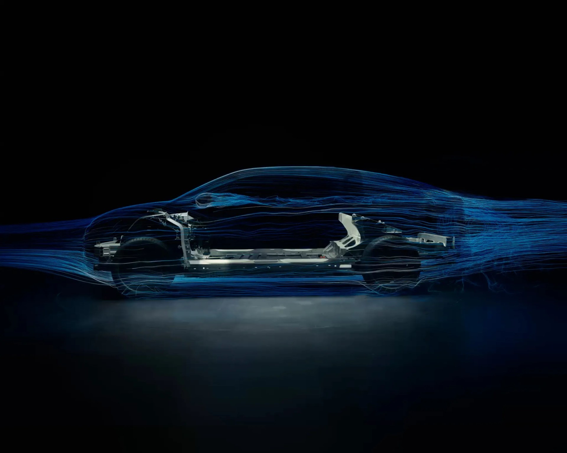 Side view of a car chassis with blue airflow lines showing aerodynamic flow around the vehicle.