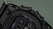 Close-up of a black Casio digital watch with rugged buttons and a protective bezel.