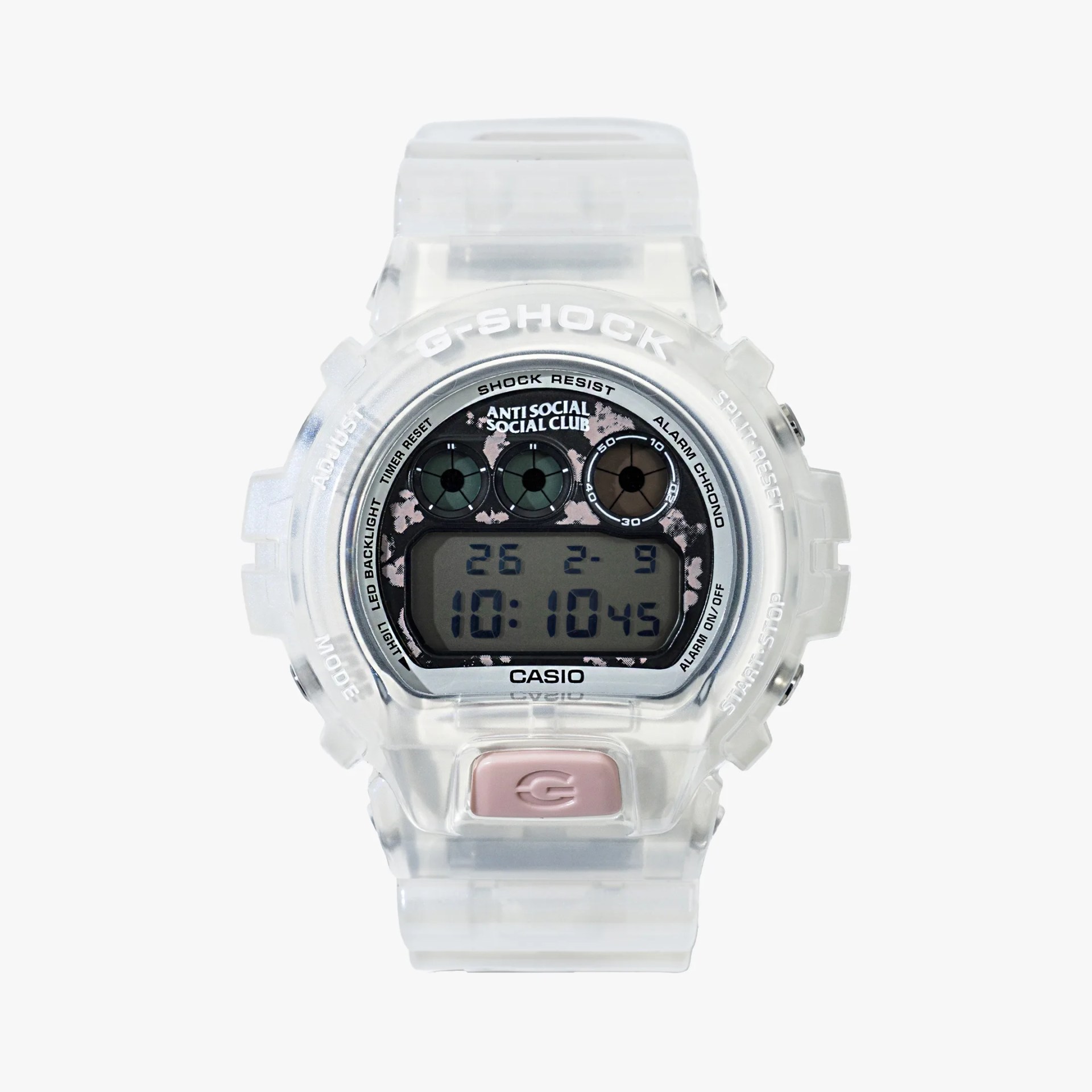 Transparent Casio G-Shock digital watch with pink button and Anti Social Social Club logo on the face.