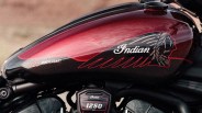 Glossy red and black Indian motorcycle fuel tank with "125 Anniversary" and Native American head logo.