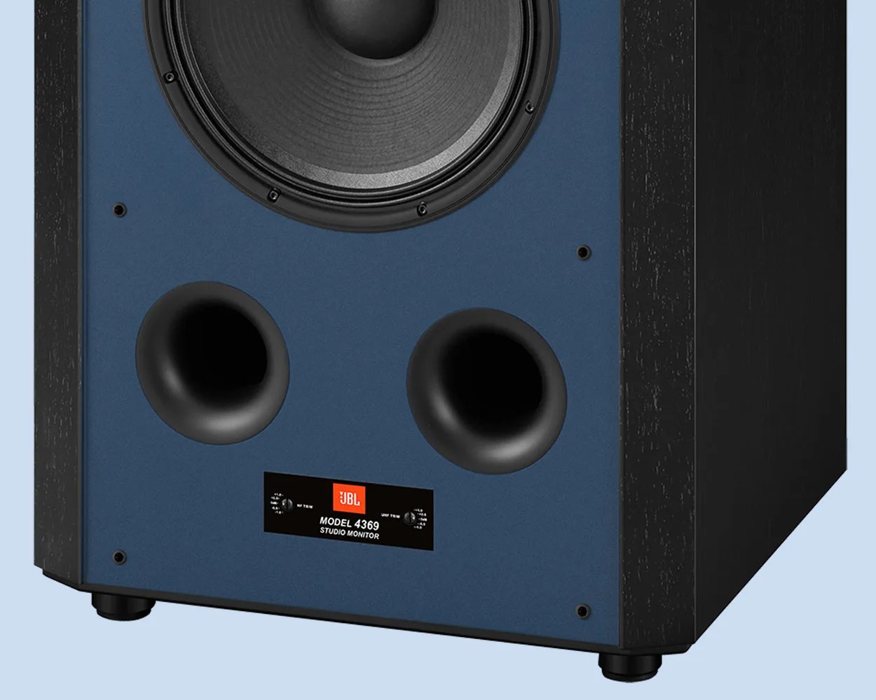 Close-up of the bottom front panel of a JBL Model 4369 studio monitor speaker with dual bass ports and a blue front.
