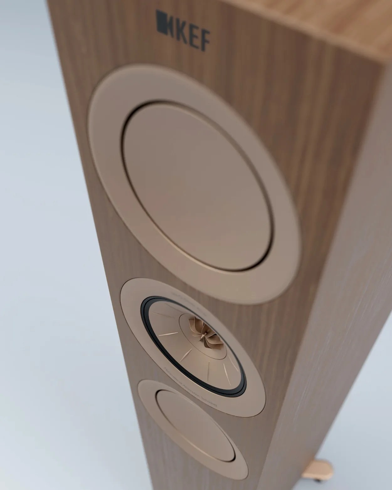 Tall wooden KEF speaker with three circular drivers on the front panel.