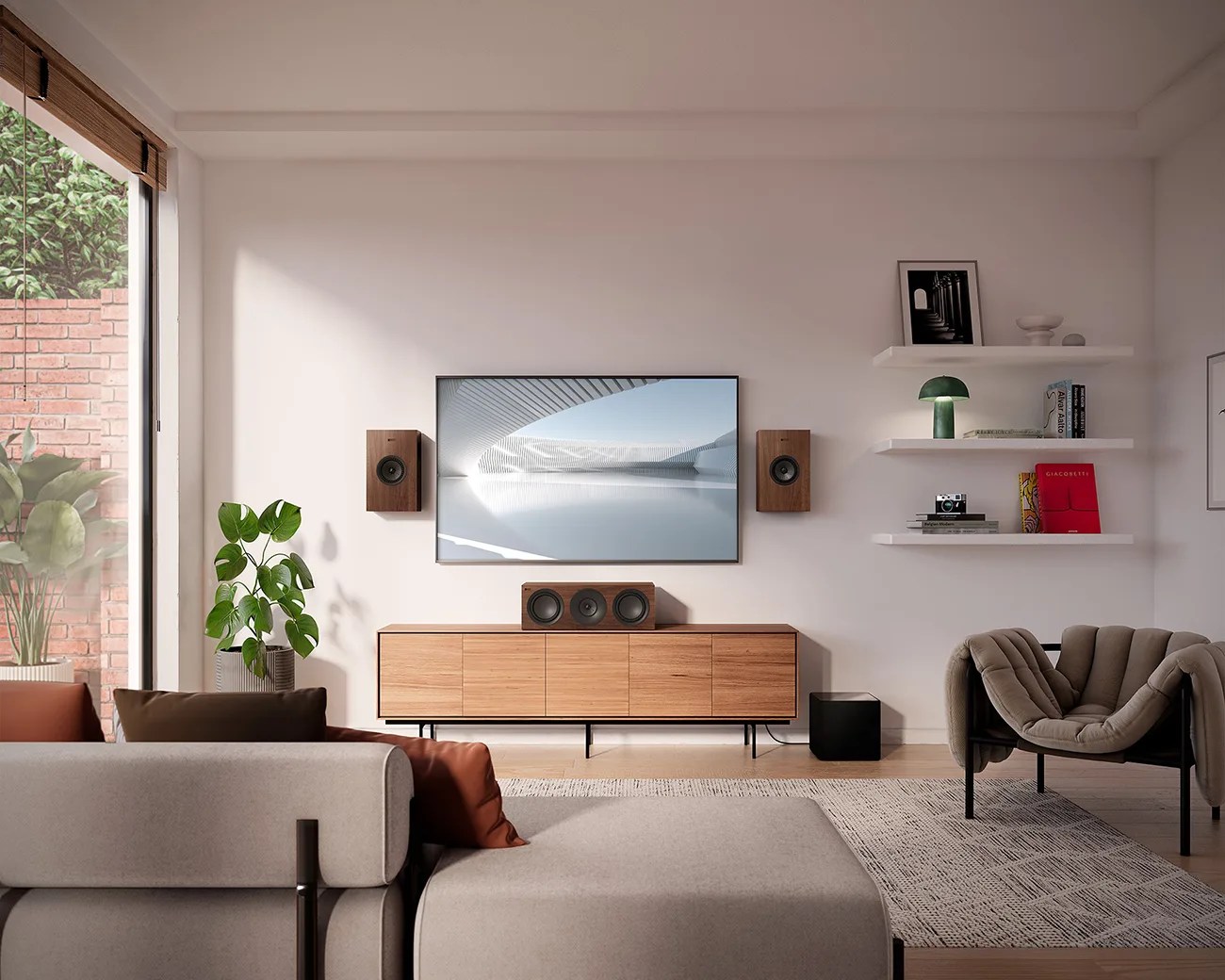 Modern living room with a wall-mounted TV, wooden speakers, wooden cabinet, gray sofa, and a unique cushioned chair.