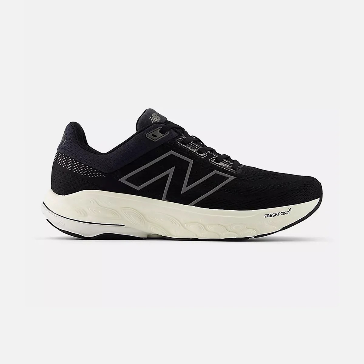 Black New Balance running shoe with white Fresh Foam sole and reflective logo on side.