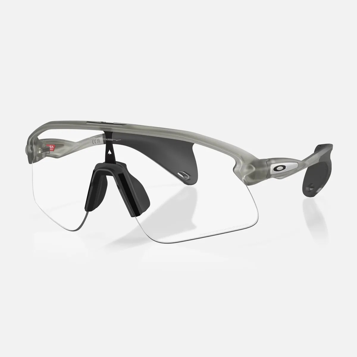 Clear wraparound sports sunglasses with translucent gray frame and black nose pads.