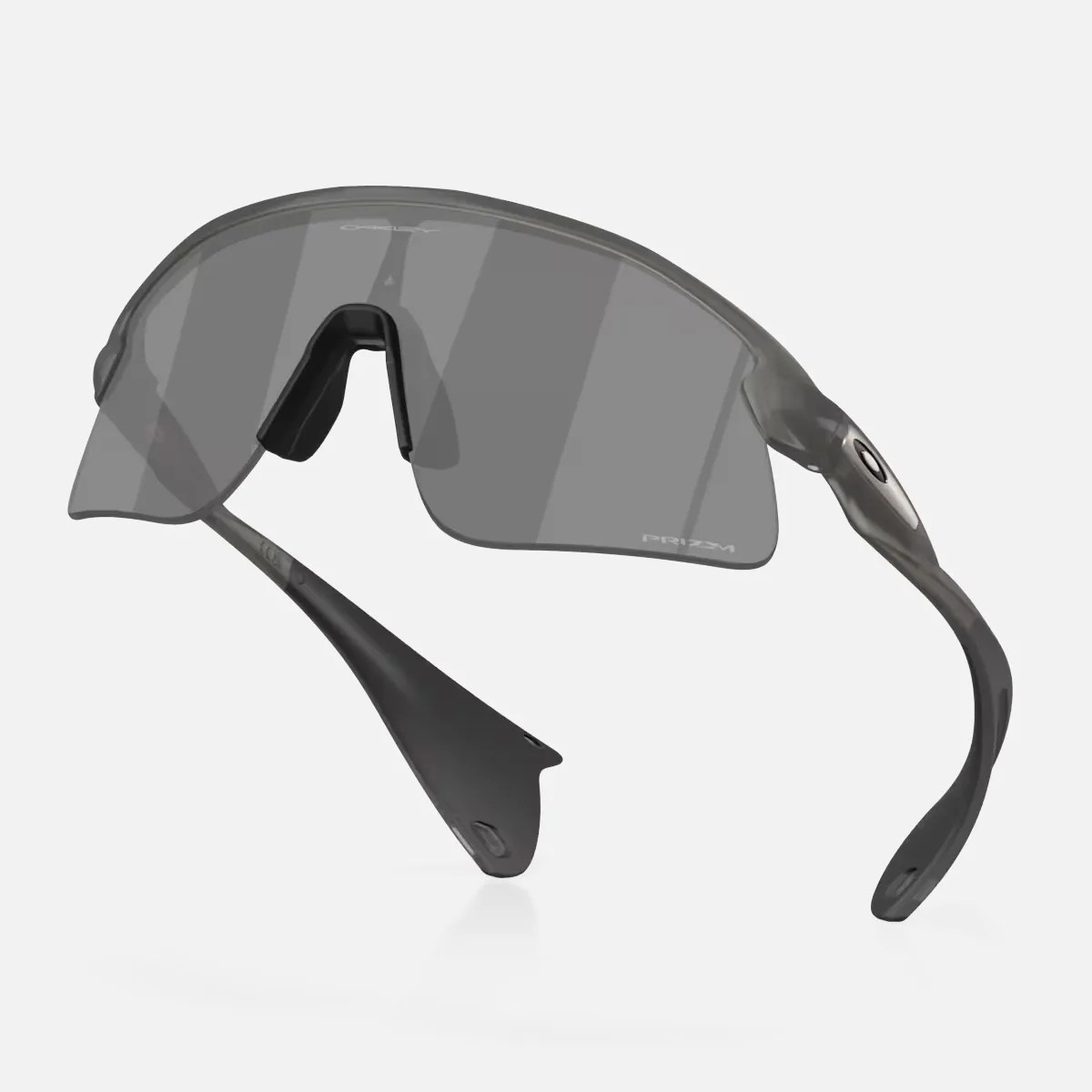 Gray Oakley sports sunglasses with a single wraparound Prizm lens and black temple tips.