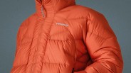 Orange Patagonia puffer jacket with a front zipper and embroidered logo on the chest.