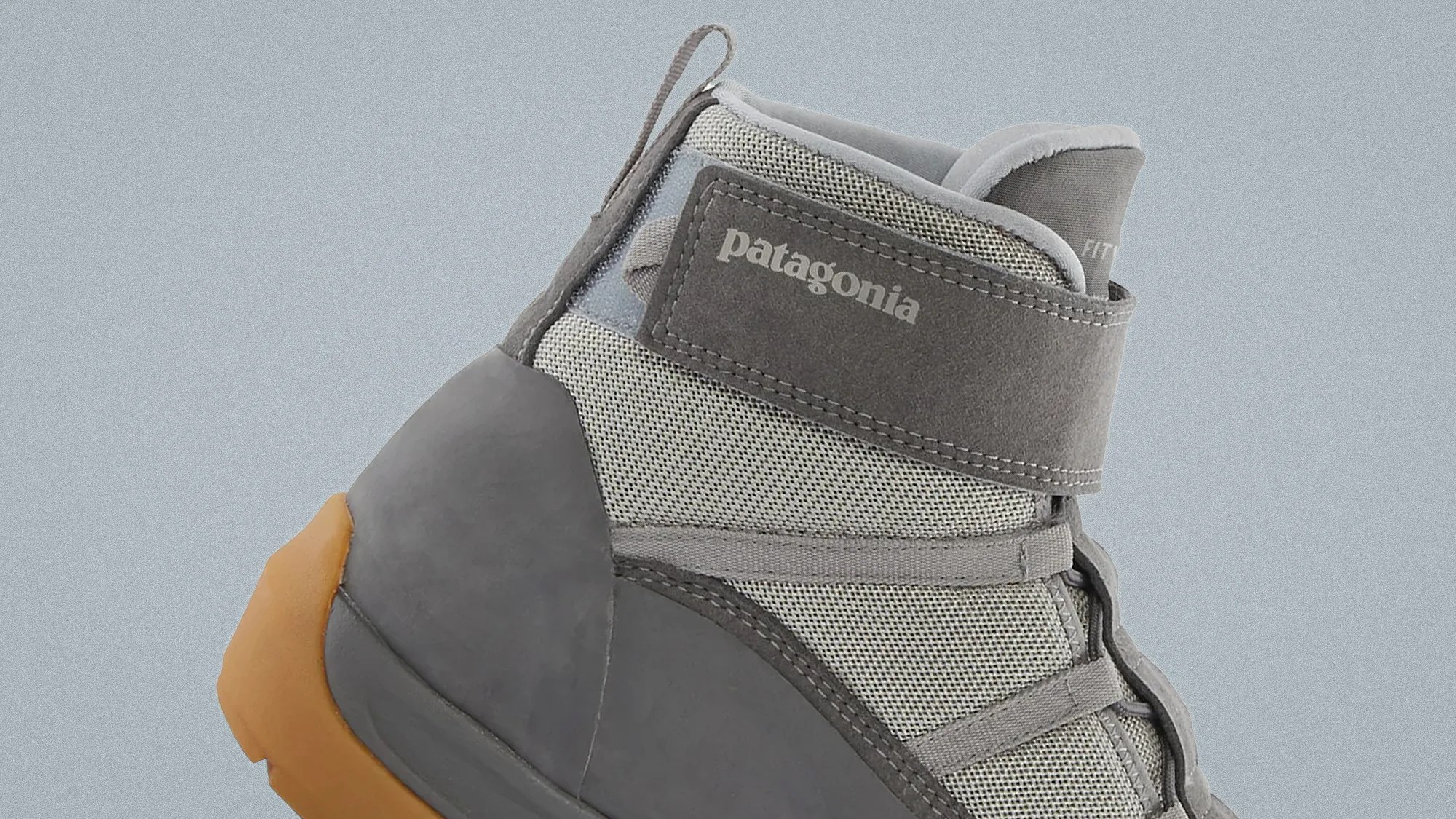 Gray and tan Patagonia hiking boot with mesh and suede upper and rubber sole.