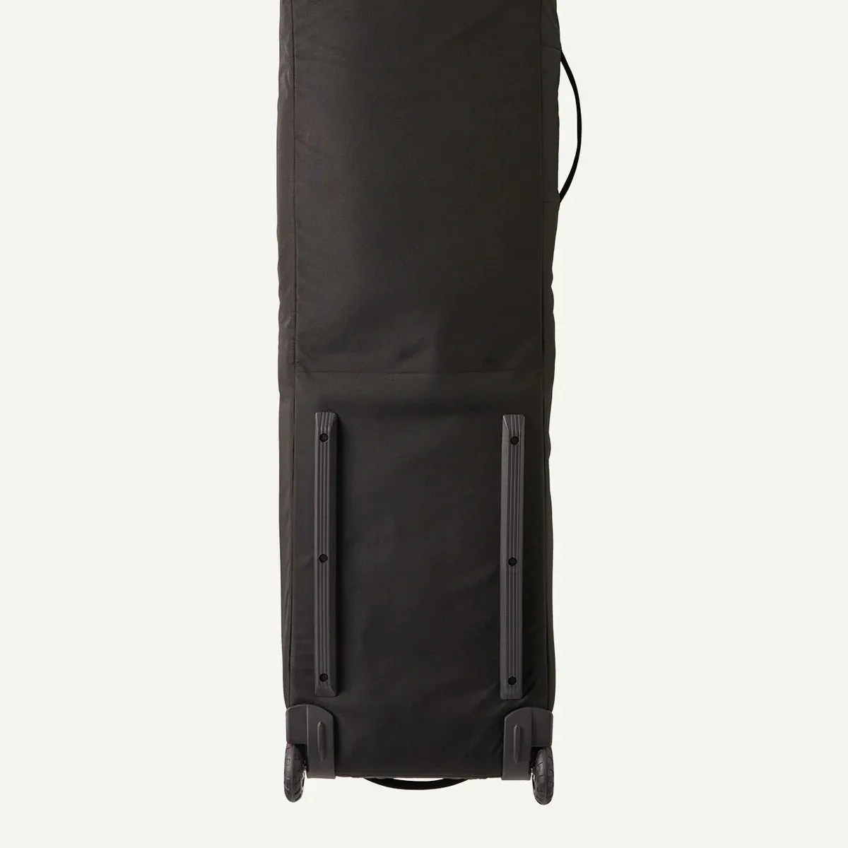 Black wheeled luggage bag with two wheels and a side handle, shown from the bottom.