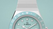 Silver Timex Q wristwatch with a light blue dial and matching bezel.