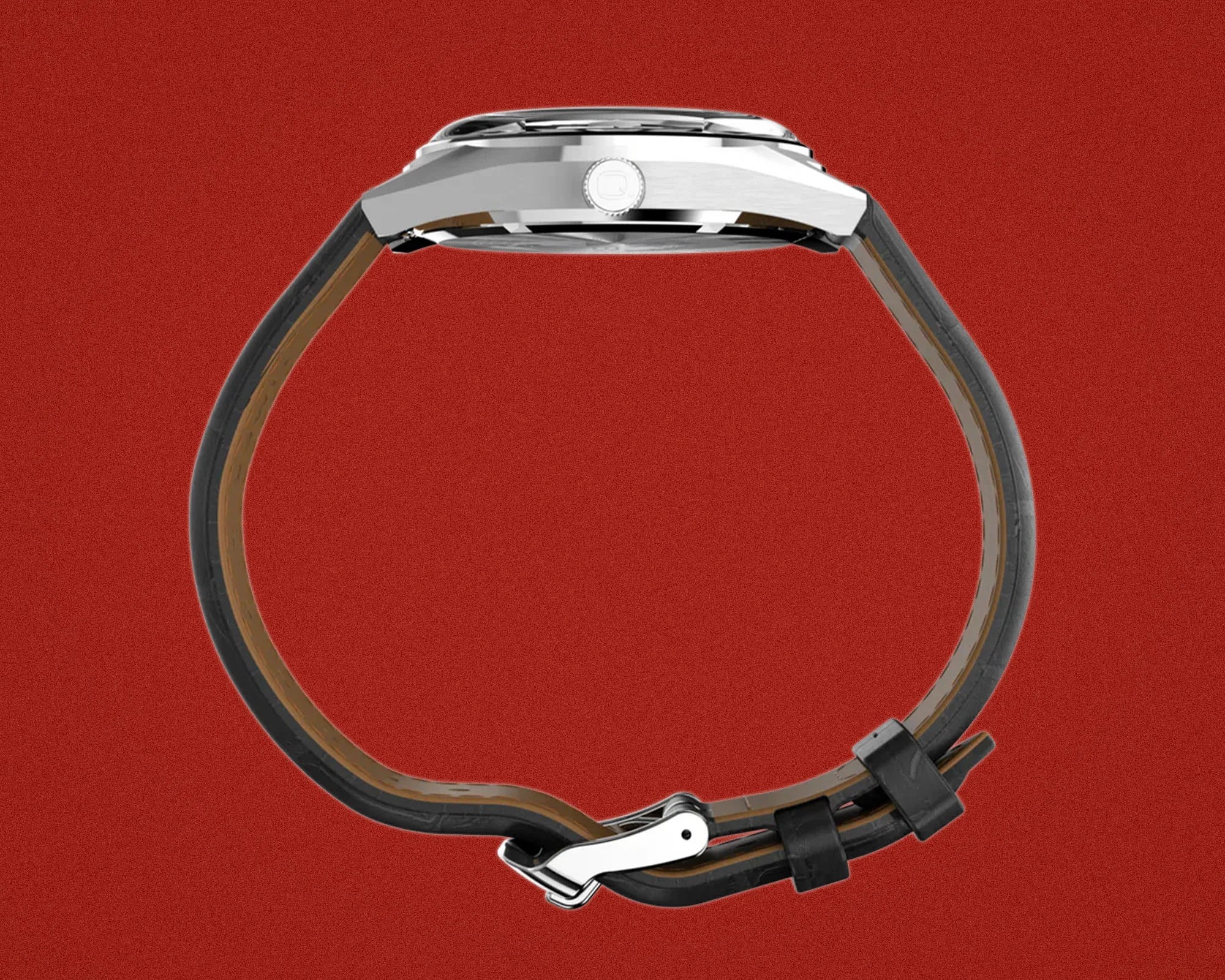 Side view of a silver watch with a black leather strap and a metal clasp on a red background.