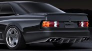 Rear side of a black Mercedes-Benz coupe with tinted windows, quad exhausts, and RennTech license plate.
