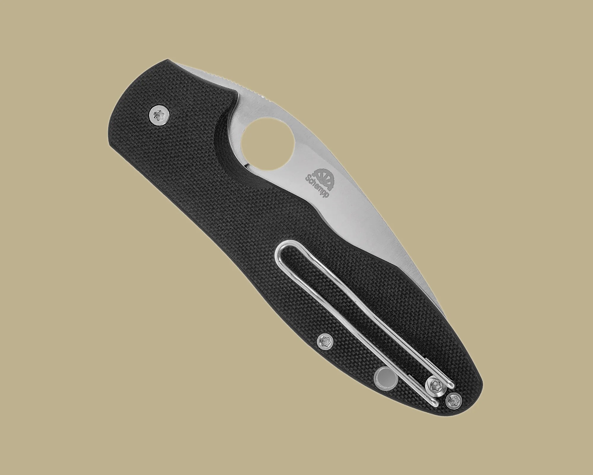 Black textured folding pocket knife with a partially visible stainless steel blade and metal clip on a beige background.