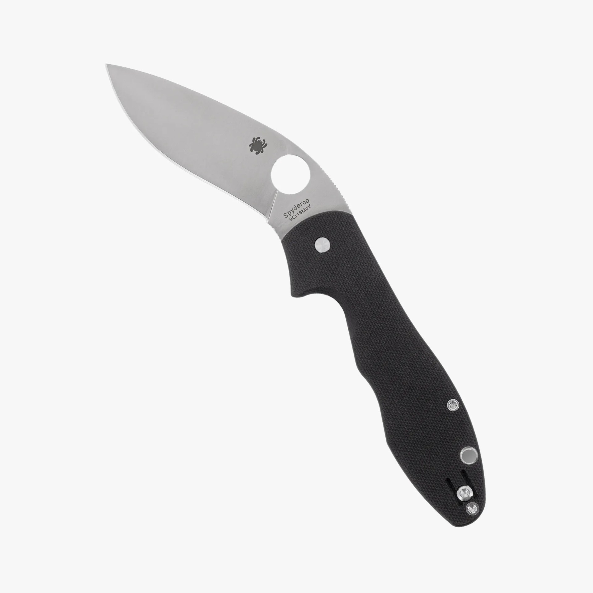 Folding knife with a stainless steel blade and black textured handle, featuring a circular thumb hole near the blade base.