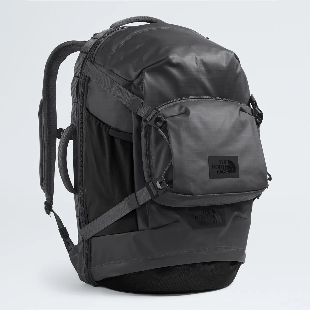 Black The North Face backpack with multiple compartments and adjustable straps.