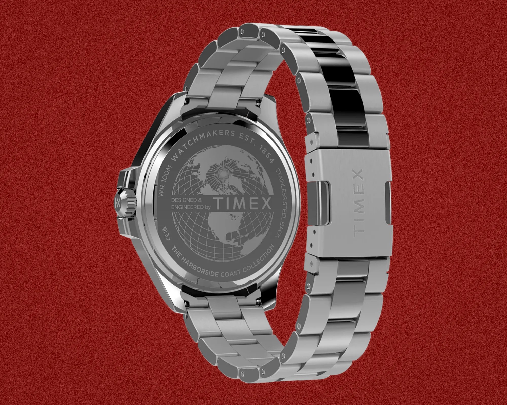 Silver stainless steel Timex watch band with black center links and engraved clasp on a red background.