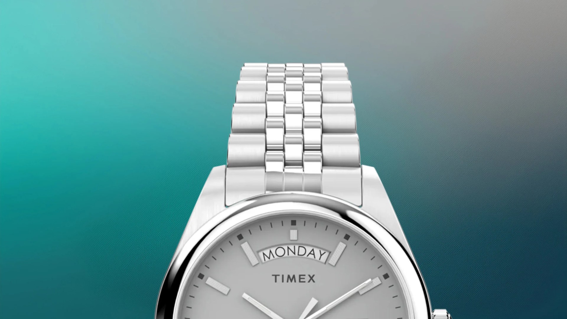 Silver Timex wristwatch with a metal link band and a day display showing "Monday.