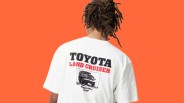 White T-shirt with black and red "Toyota Land Cruiser" text and a black graphic of a Land Cruiser on the back.