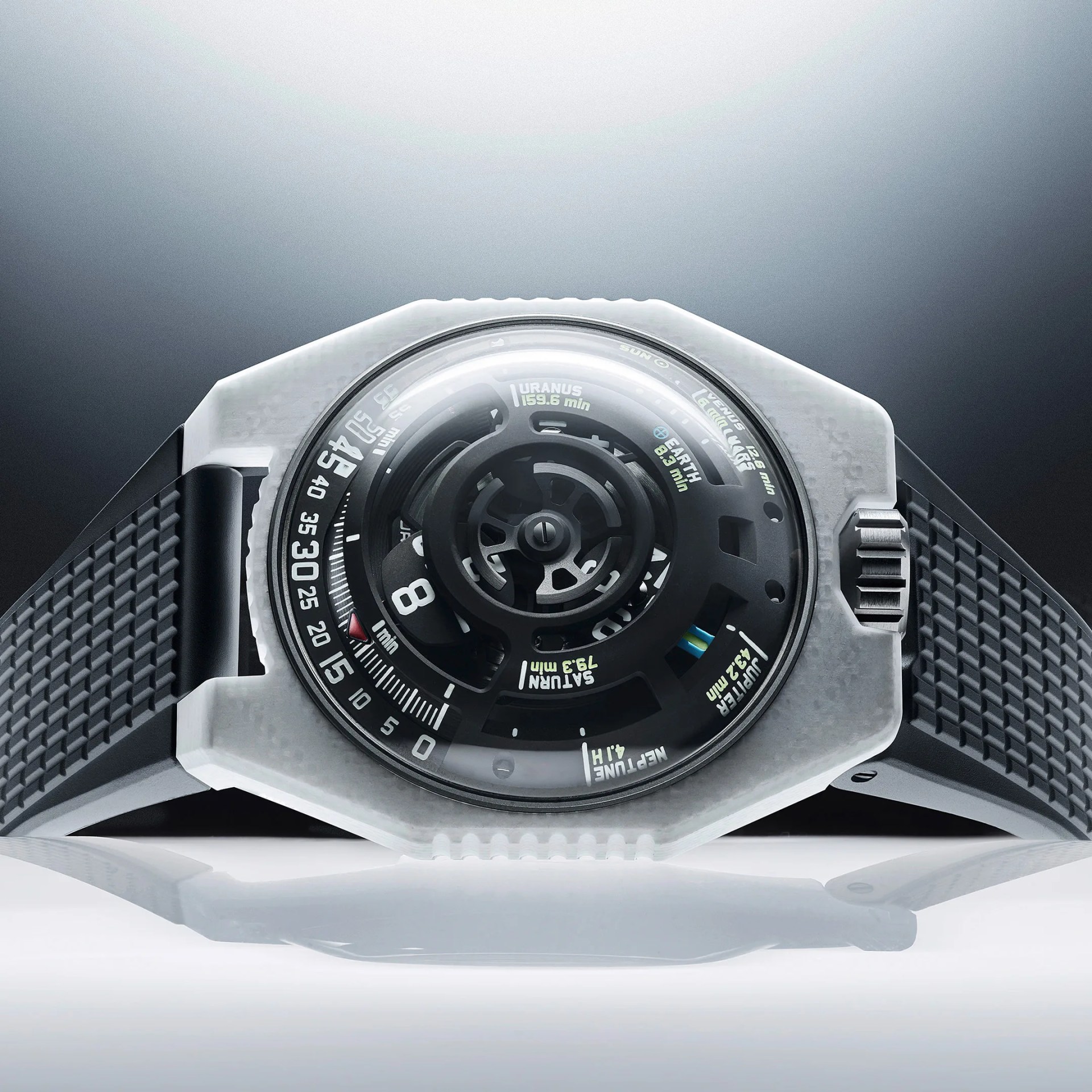 Futuristic wristwatch with a translucent white octagonal case, black textured strap, and a complex black dial showing planetary time markings.