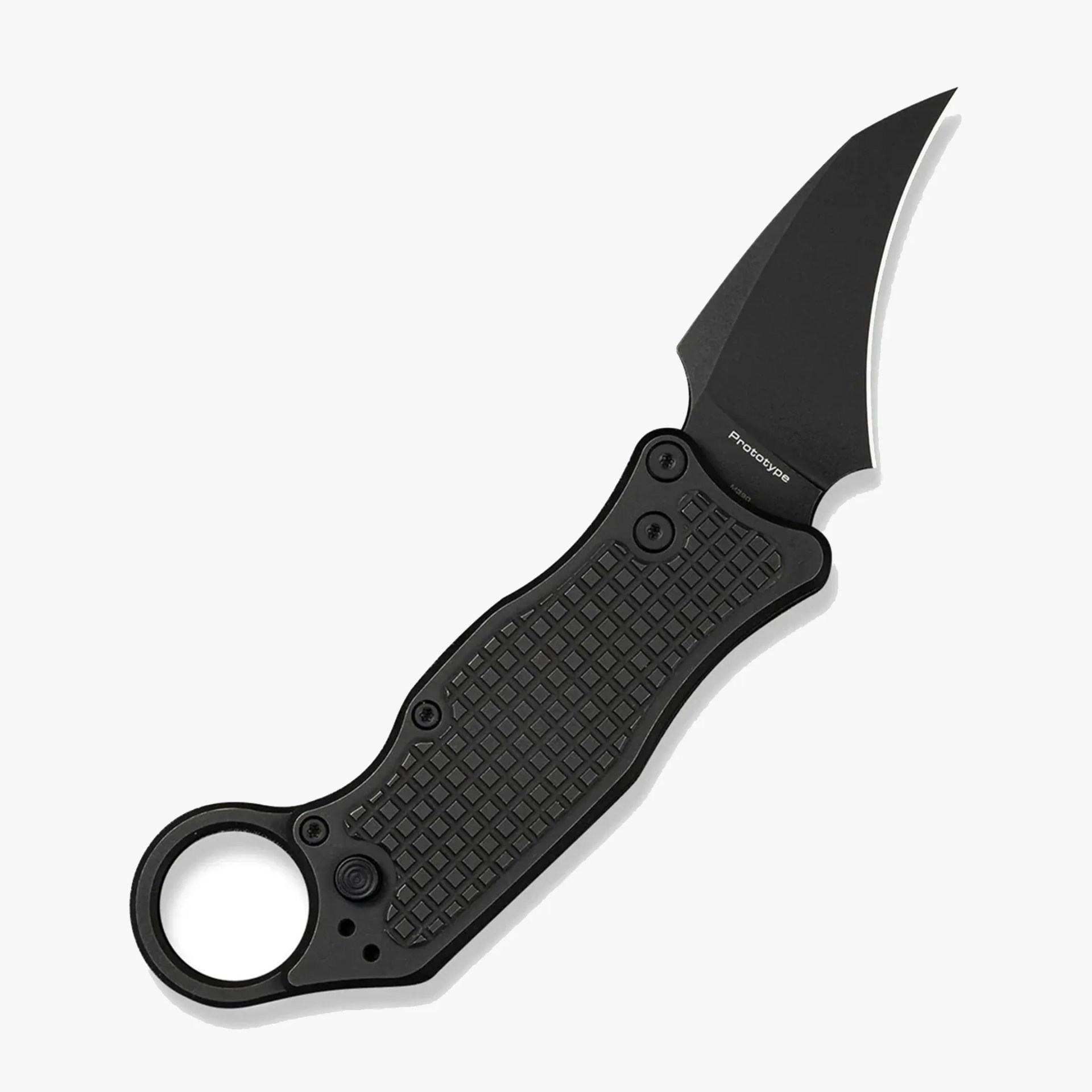 Black folding knife with textured handle and curved blade labeled "Prototype.