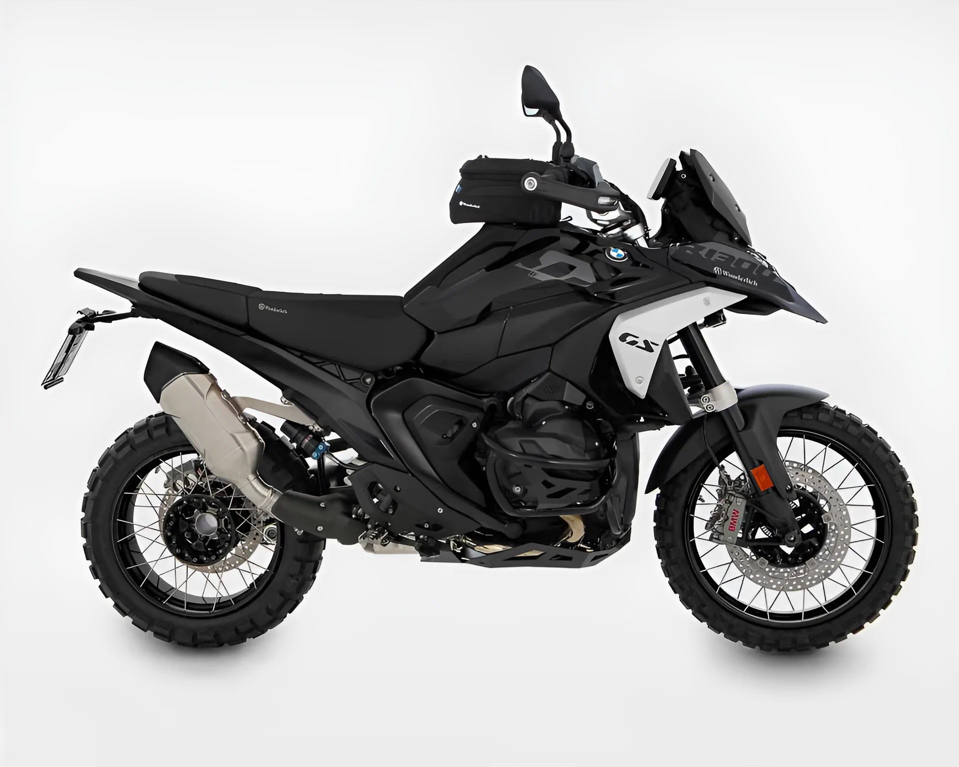 Black BMW GS adventure motorcycle with knobby tires and a small black tank bag on a white background.