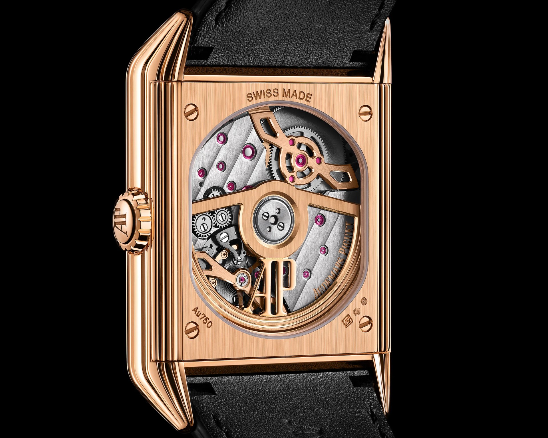 Rectangular rose gold watch case with visible mechanical movement and black leather strap.
