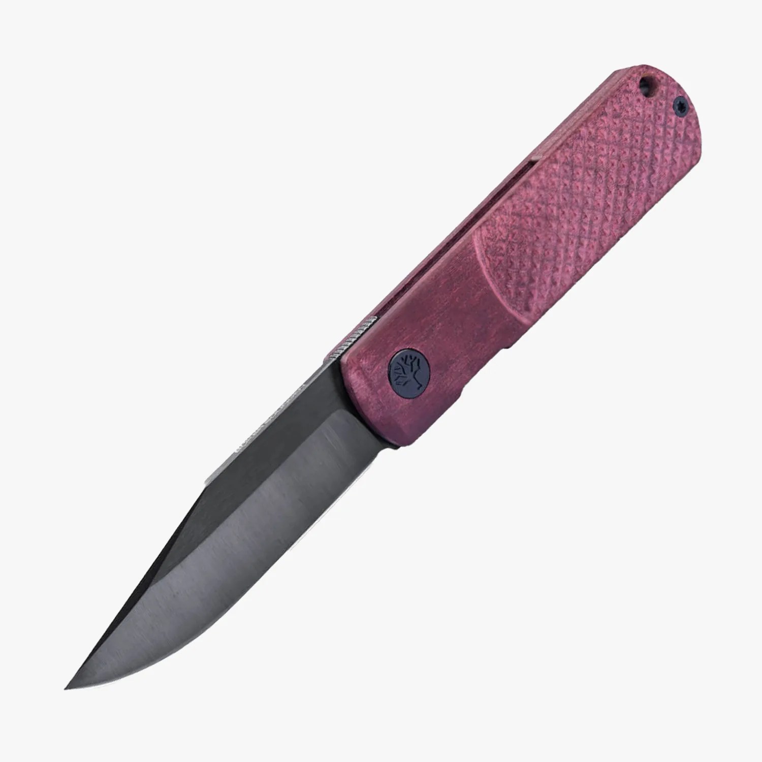Folding knife with a dark gray blade and textured purple handle featuring a small black tree logo.