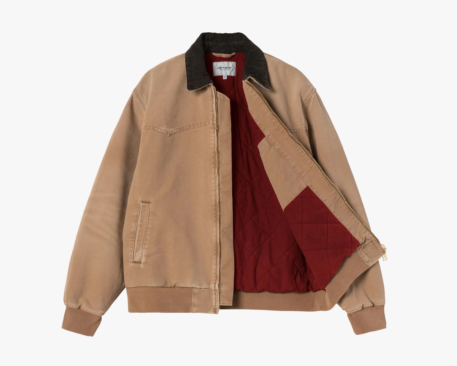 Tan canvas jacket with dark brown corduroy collar and quilted red lining, partially unzipped.