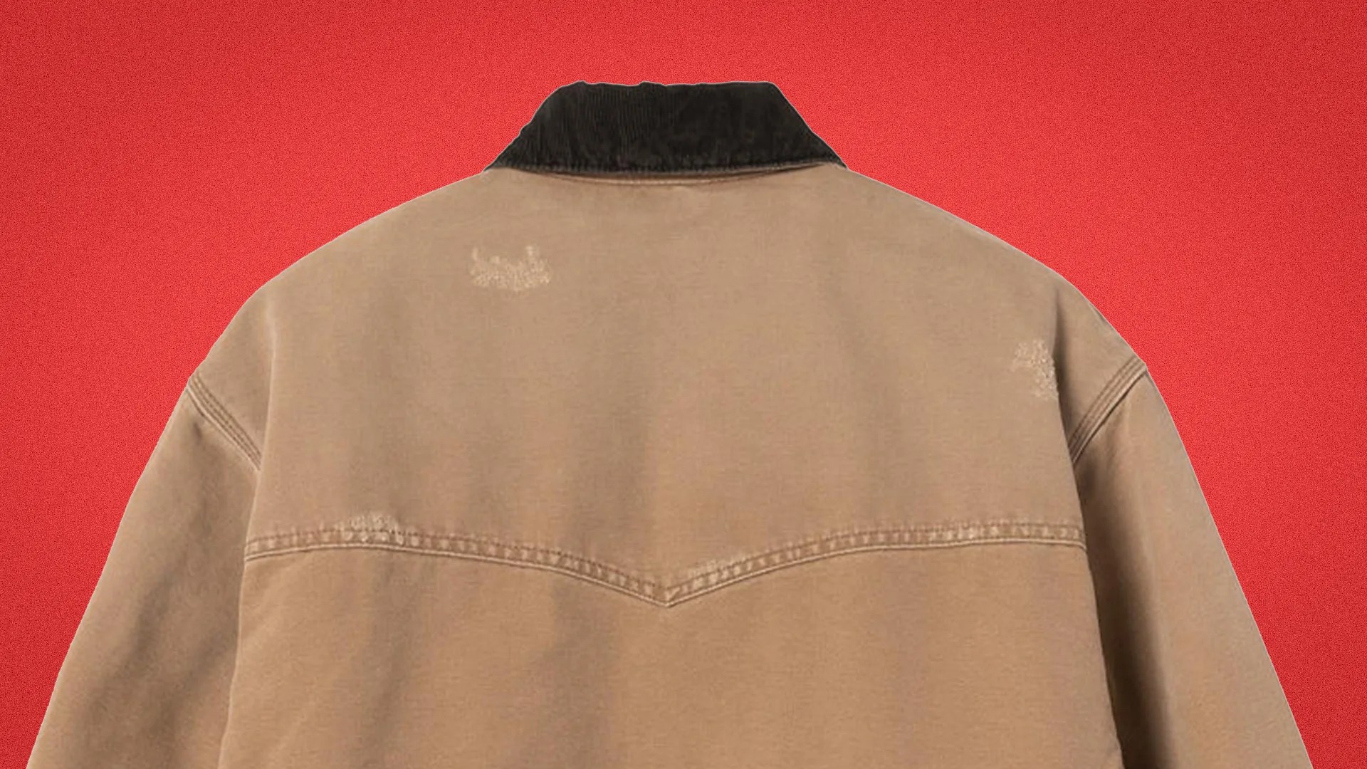 Back view of a tan jacket with a black corduroy collar and subtle distressed patches on a red background.