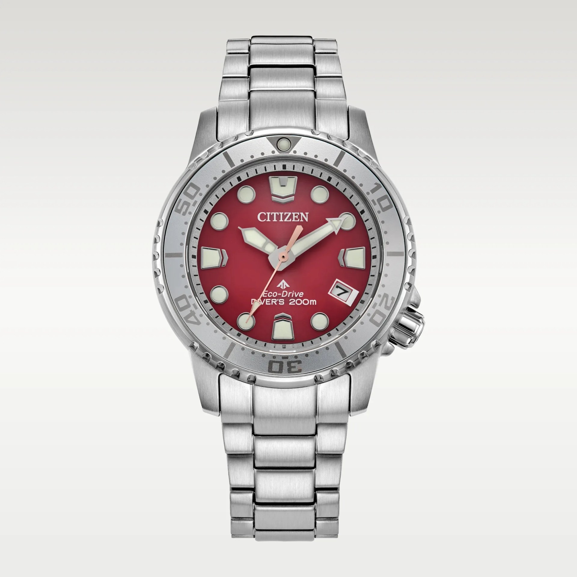 Silver stainless steel Citizen Eco-Drive diver's watch with a red dial and luminous markers.