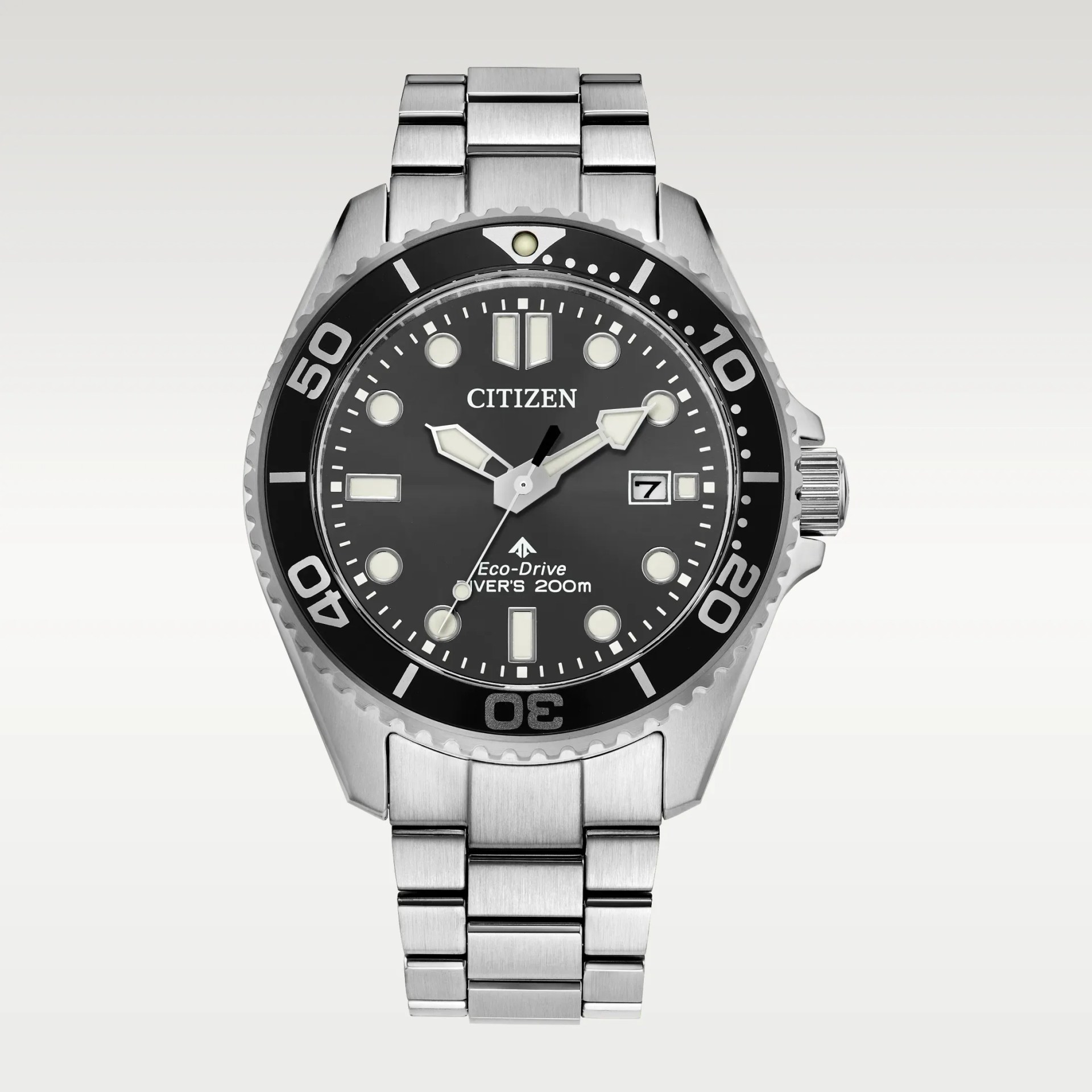 Silver stainless steel Citizen Eco-Drive diver's watch with black bezel and black dial showing date.