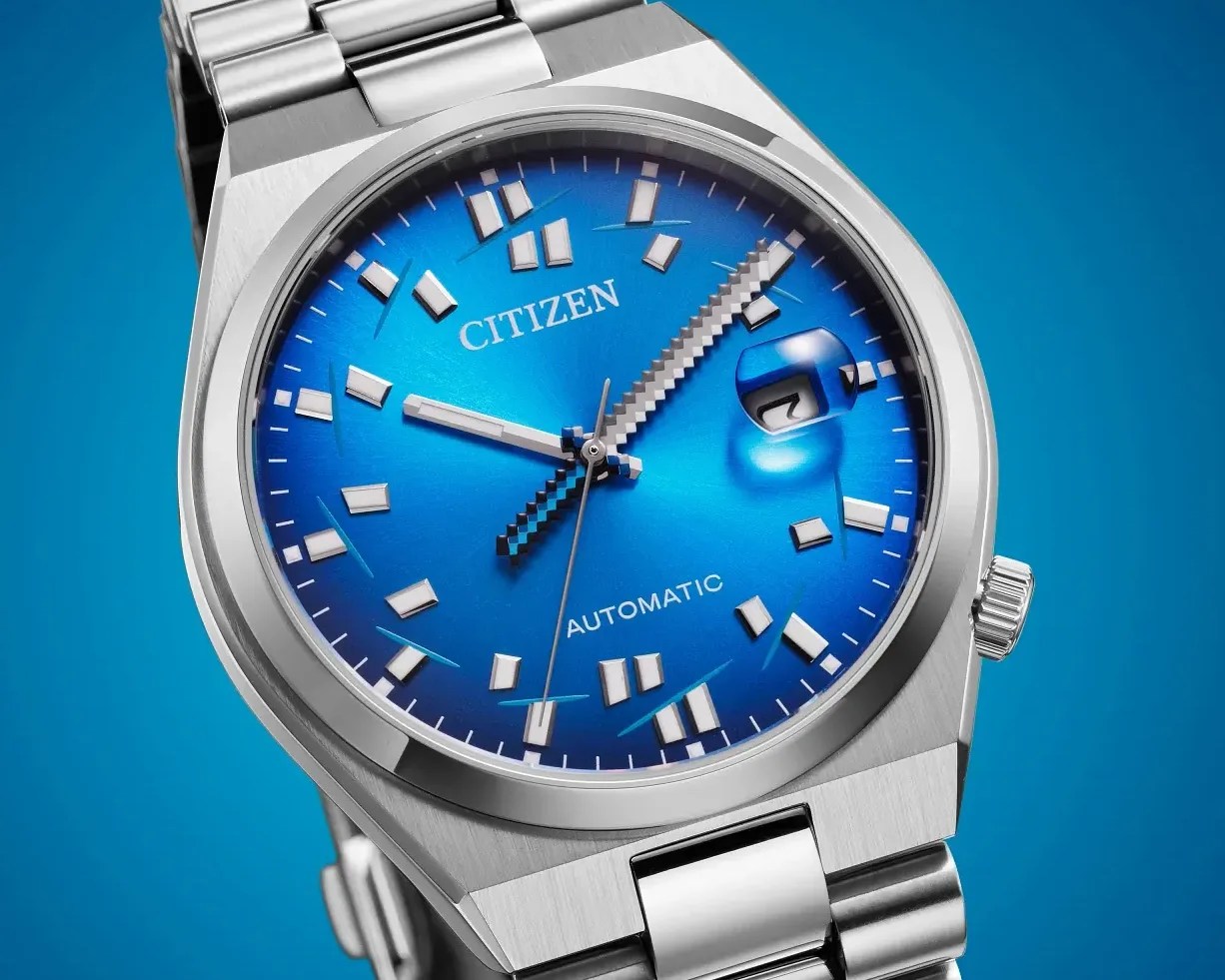 Silver Citizen automatic wristwatch with a blue dial and pixelated hour and minute hands.