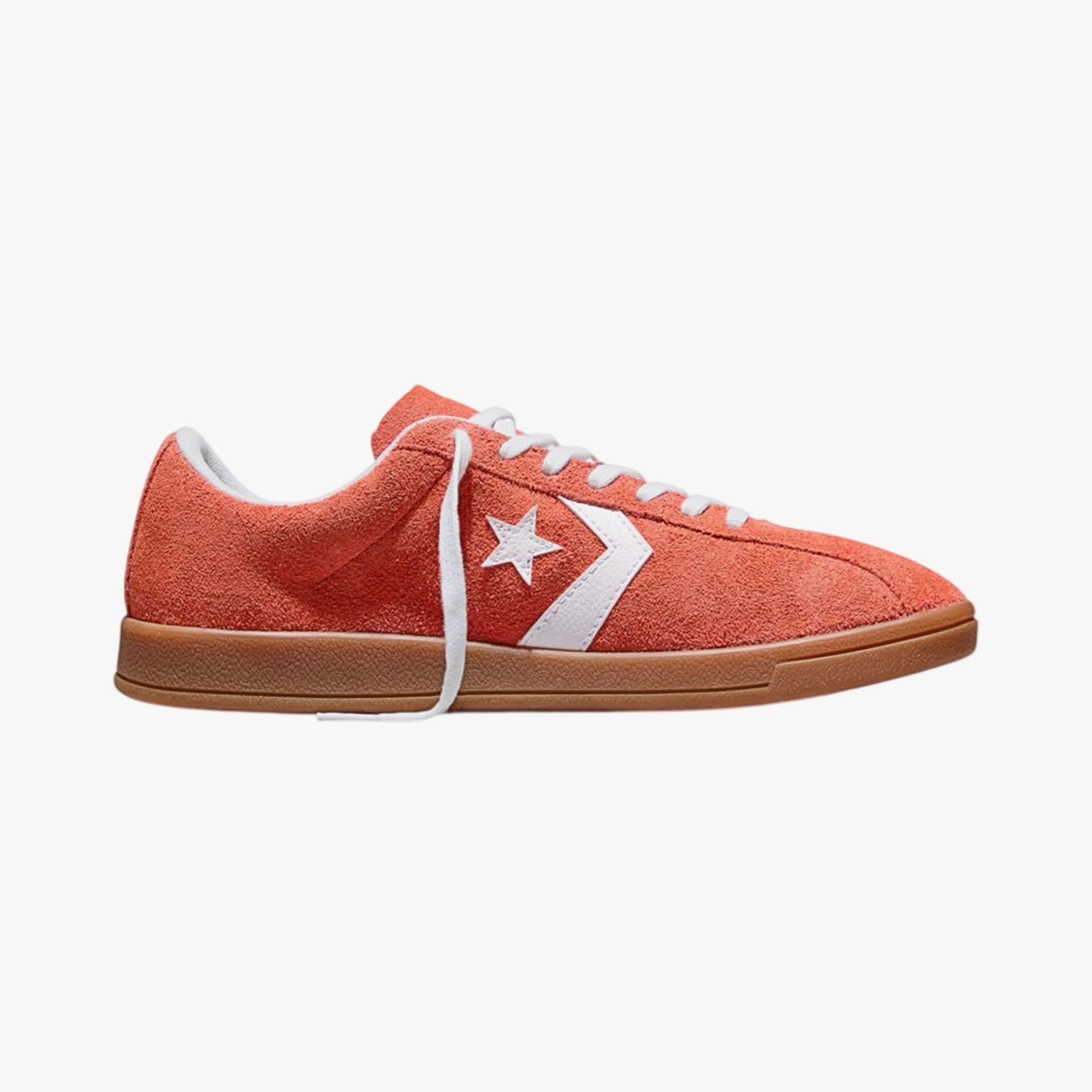 Orange suede low-top sneaker with white star logo and gum rubber sole.