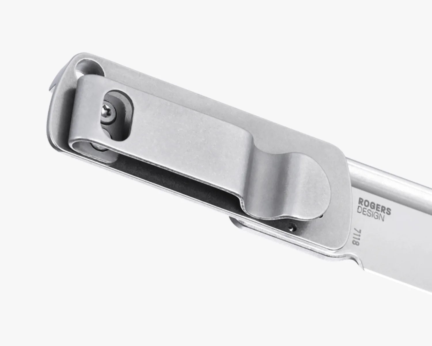 Close-up of a silver metal pocket clip attached to a folding knife blade with "ROGERS DESIGN" and "7118" engraved.