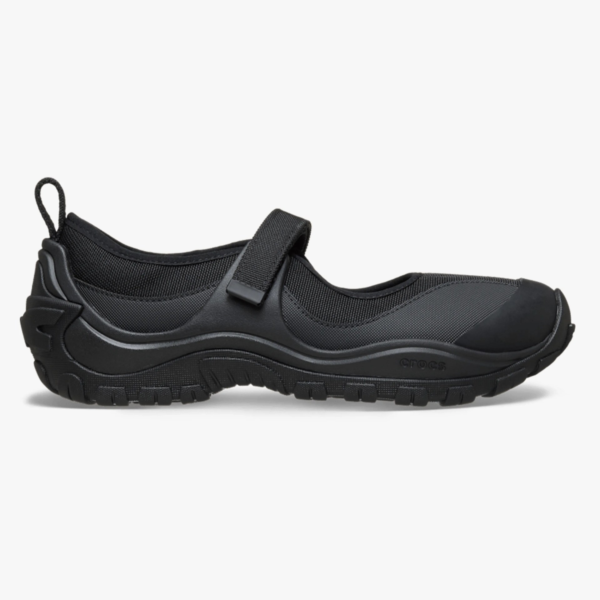 Black Mary Jane-style shoe with a textured sole and adjustable strap across the top.