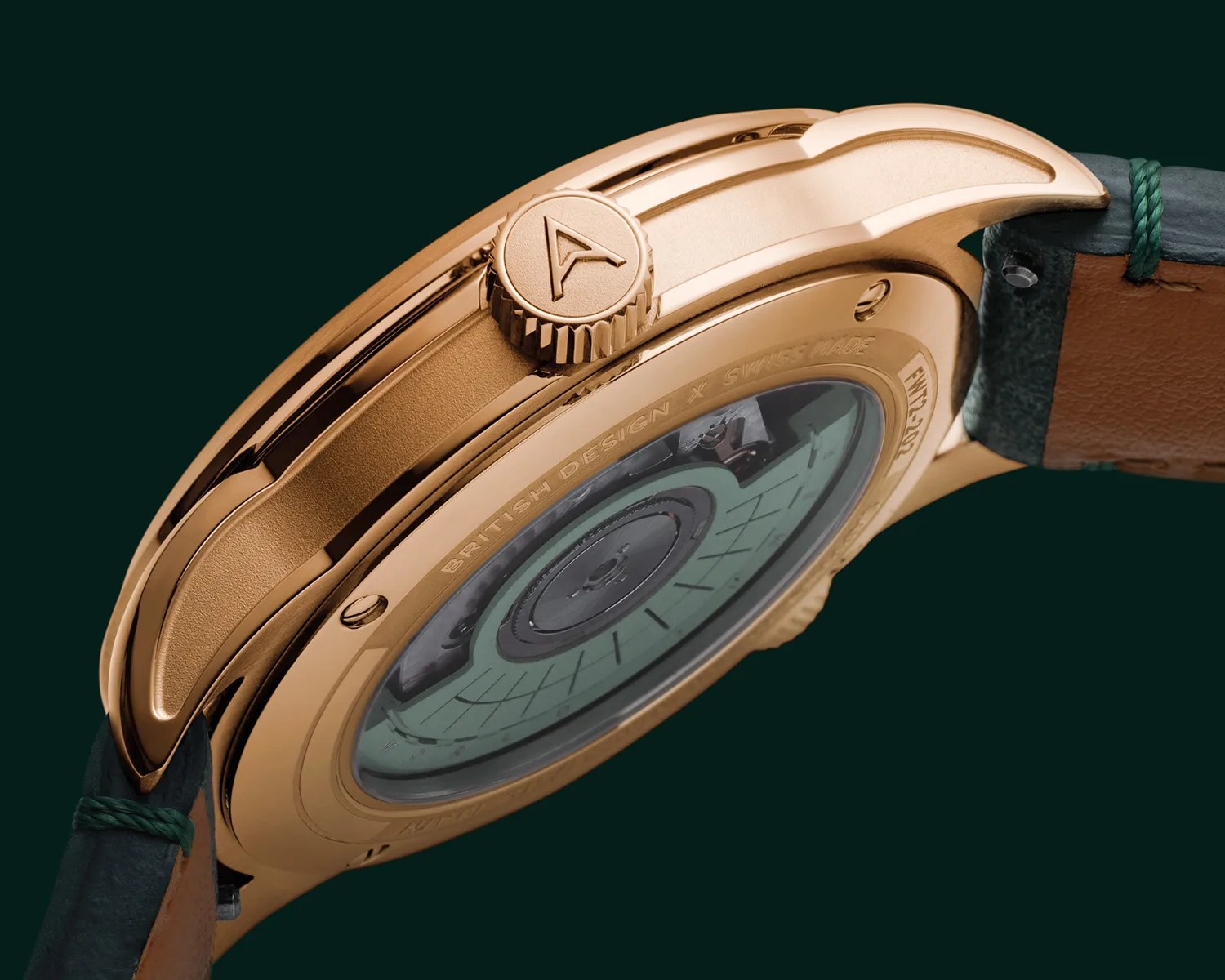 Close-up of a rose gold watch case back with visible mechanical movement and green leather strap.