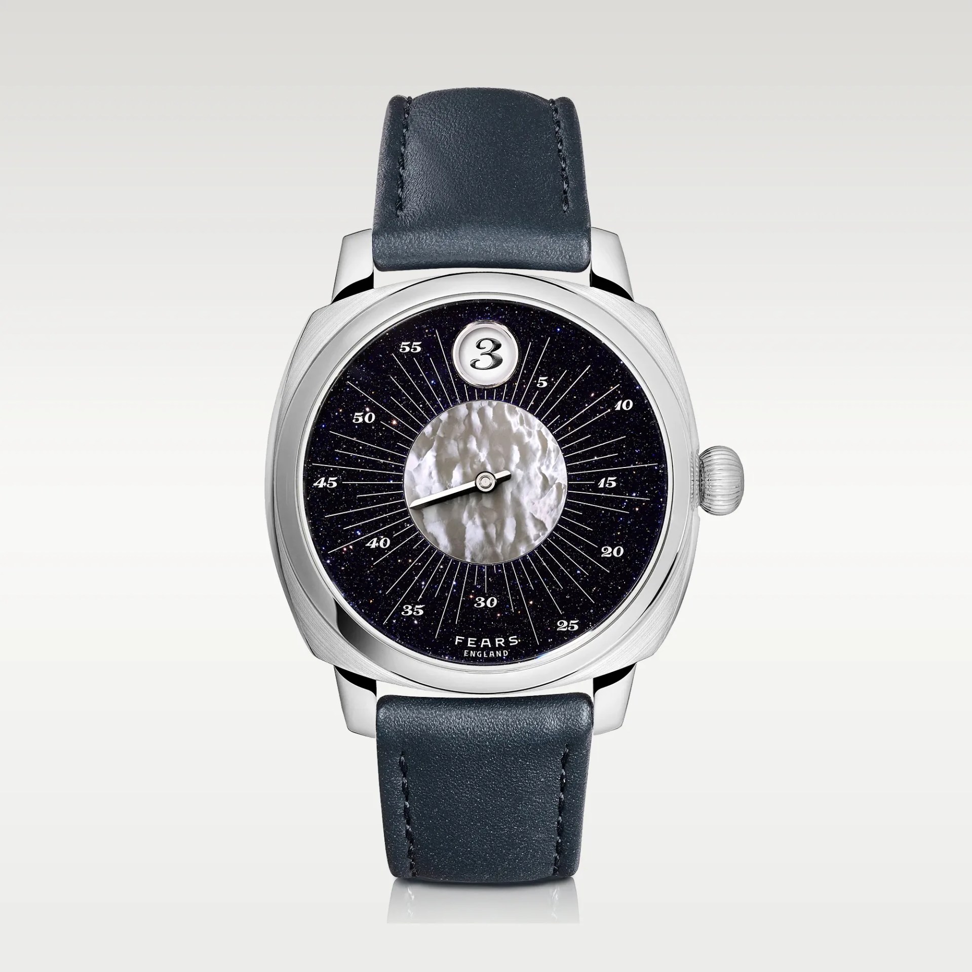 Silver wristwatch with a dark blue leather strap, black starry dial, and a textured white center circle.
