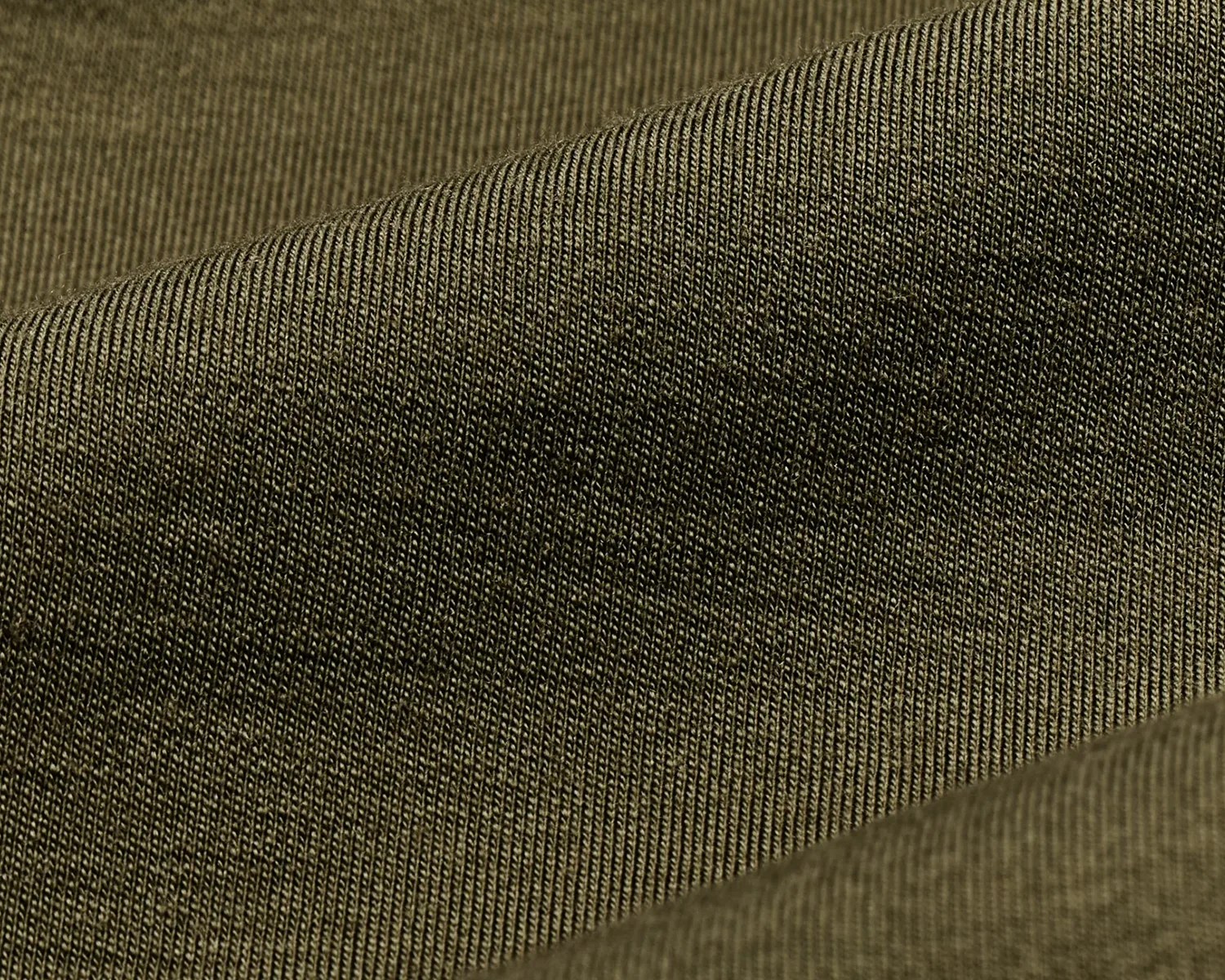 Close-up of olive green ribbed knit fabric with fine vertical texture.