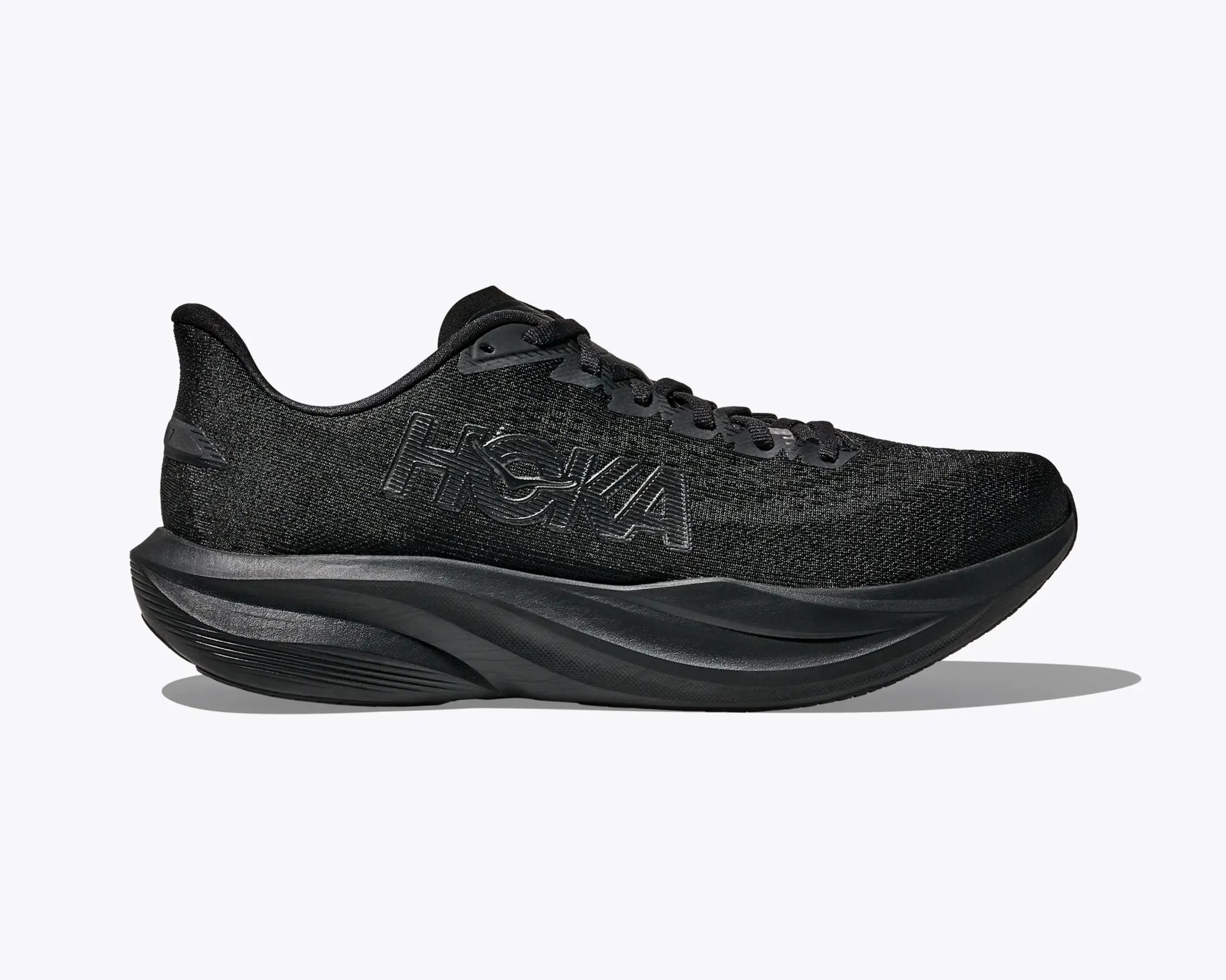 All-black Hoka running shoe with thick cushioned sole and black logo on the side.