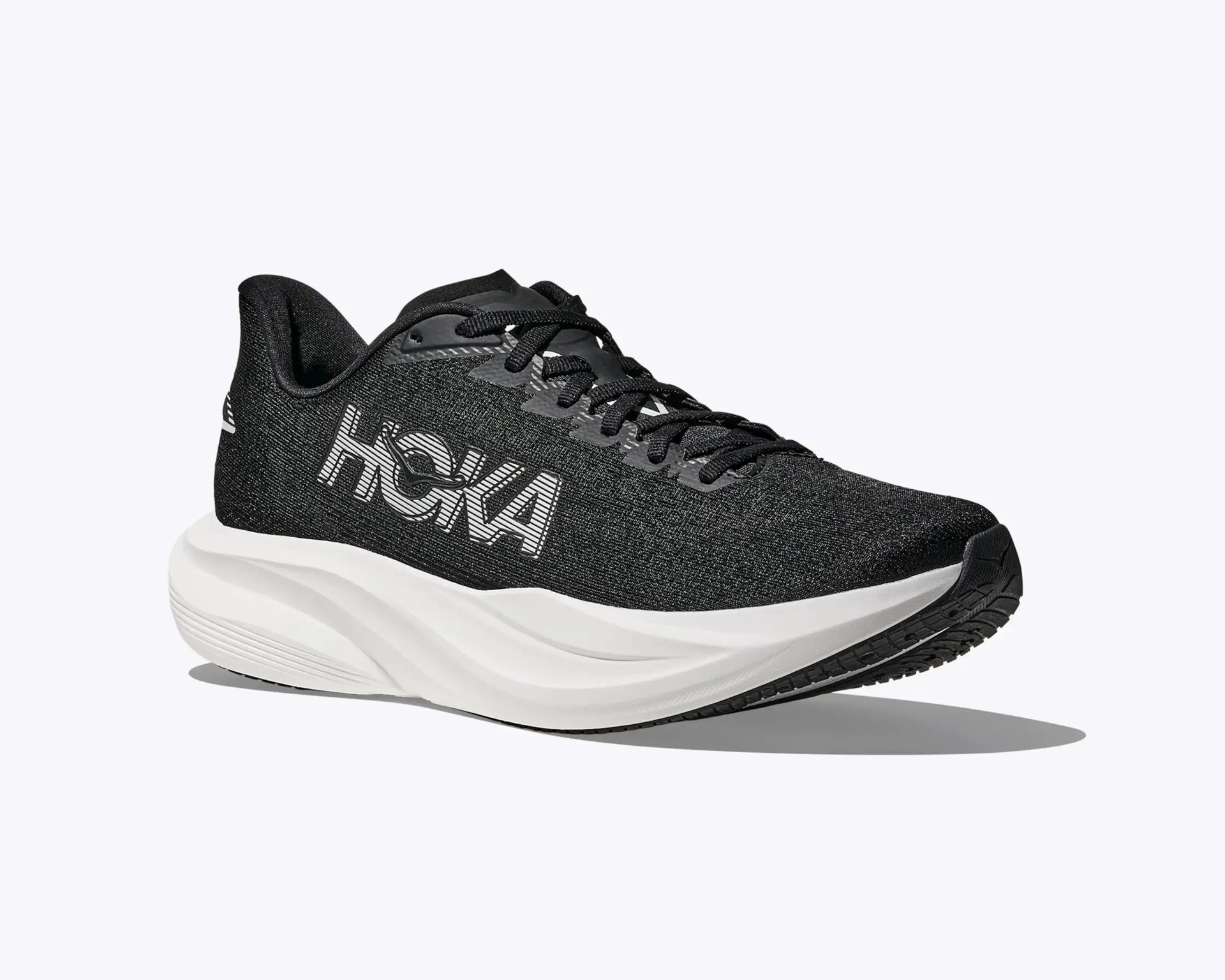 Black Hoka running shoe with white thick sole and large white HOKA logo on side.