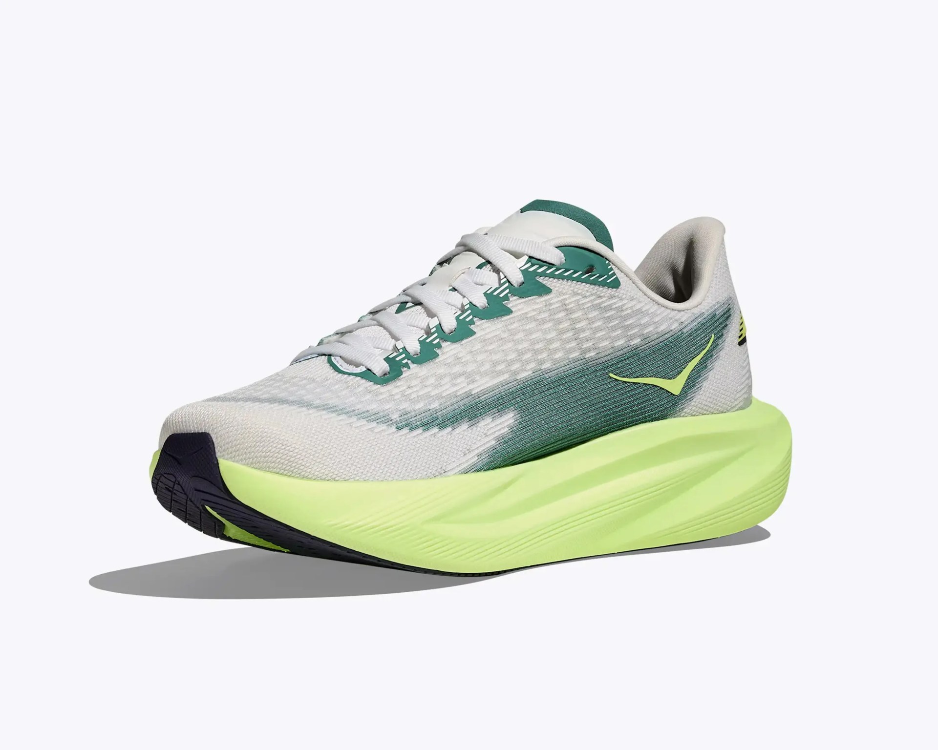 Light gray and green running shoe with neon yellow sole and white laces on a white background.