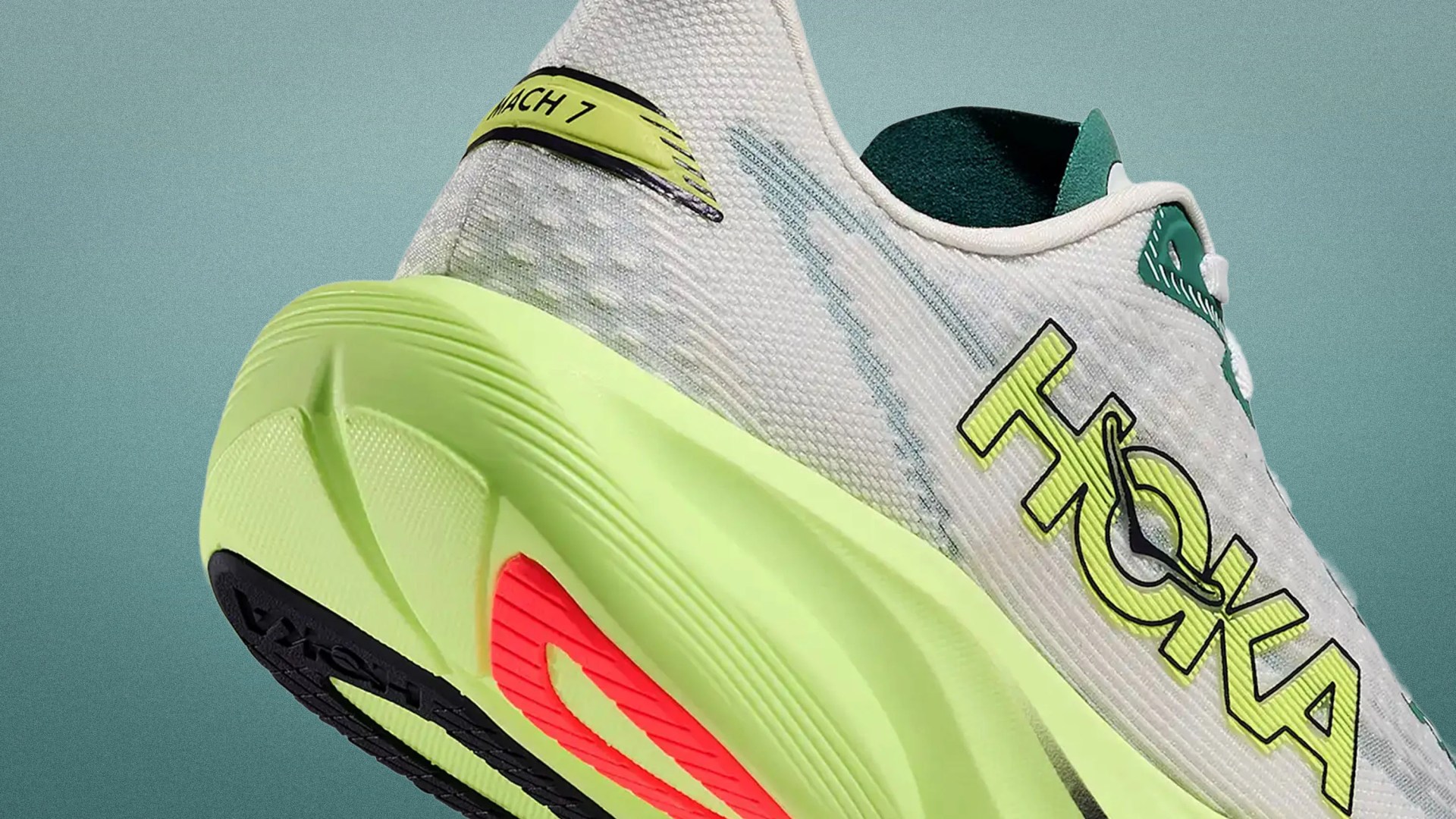 White and neon yellow Hoka Mach 7 running shoe with black and red sole accents.