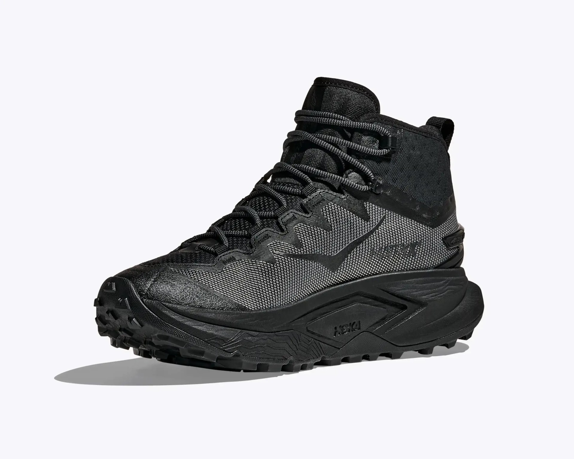 Black and dark gray high-top trail running shoe with textured mesh upper and rugged sole.