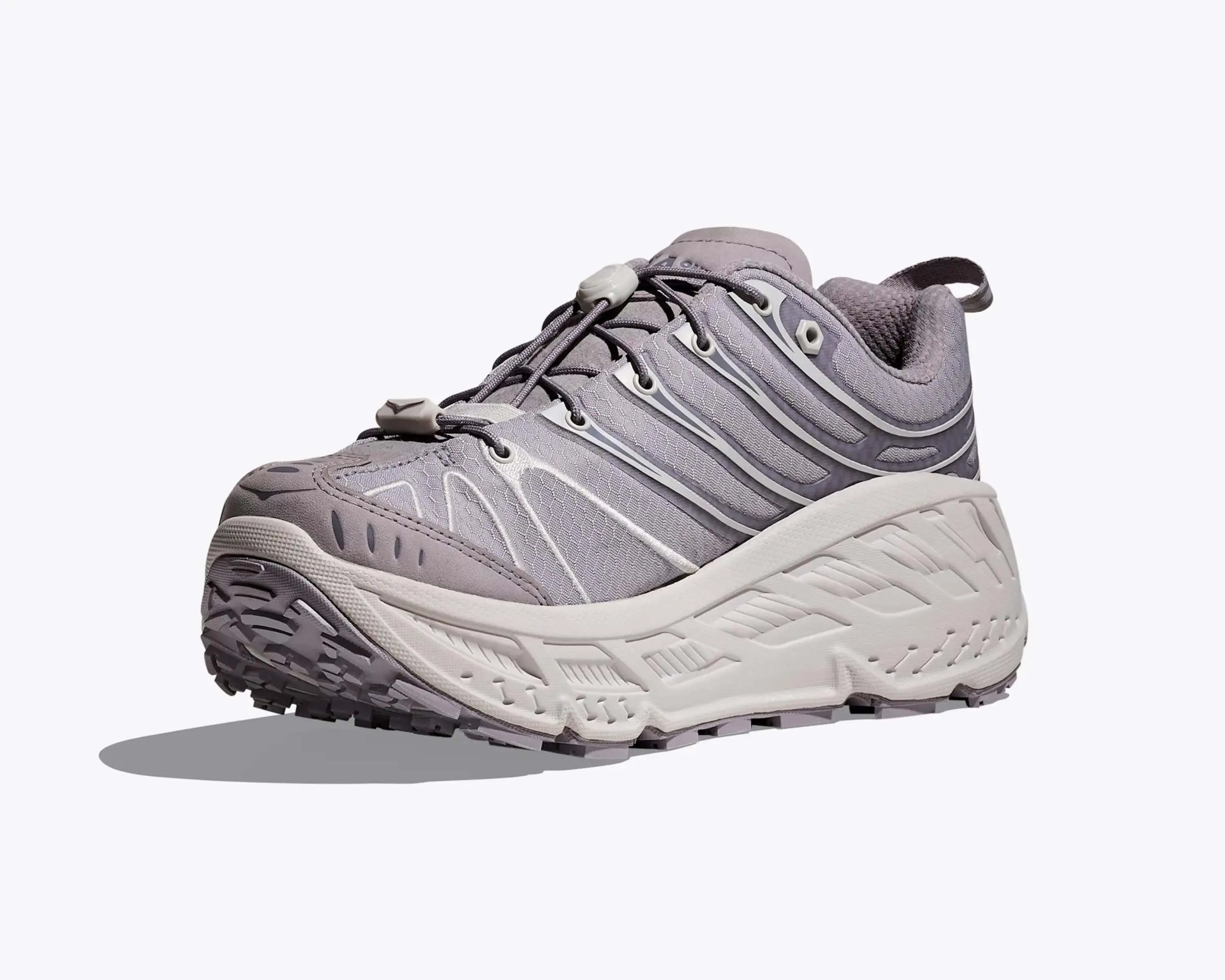 Light gray athletic shoe with thick white sole and elastic toggle laces on a white background.